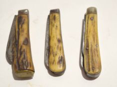 **Mixed Lot: comprising three various folding knives, each with antler grips including two bladed