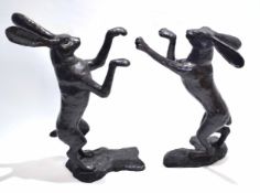 Pair of good quality modern bronze models of boxing hares, each stood on hind legs, 45cm wide x 87cm