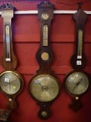 Mid-19th century mahogany cased wheel barometer with swan necked pediment over a silvered hygrometer