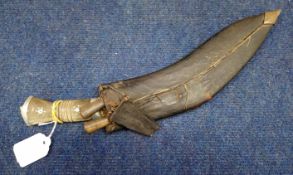 Second half of 20th century horn handled Kukri of typical form with aluminium lion mask pommel and