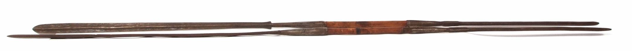 **Two 20th century African assegai spears, each of typical form with elongated double sided blades