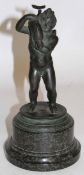 Antique spelter figure modelled as a putti holding a dolphin mounted on a marble base, 30cm high