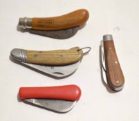 **Mixed Lot: comprising four various folding gardening knives including three wooden handled