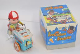 Late 20th century boxed tinplate ice cream seller on tricycle, height approximately 11cm