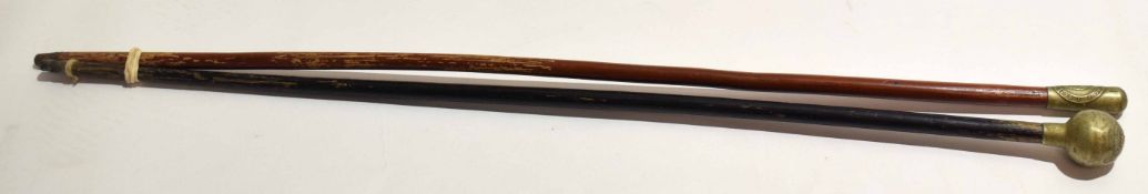 **Mixed Lot comprising two various base metal capped and lacquered swagger sticks, longest 70cm,