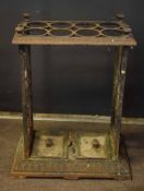 Victorian cast iron rectangular stick stand, the top with eight interlocking circles with urn