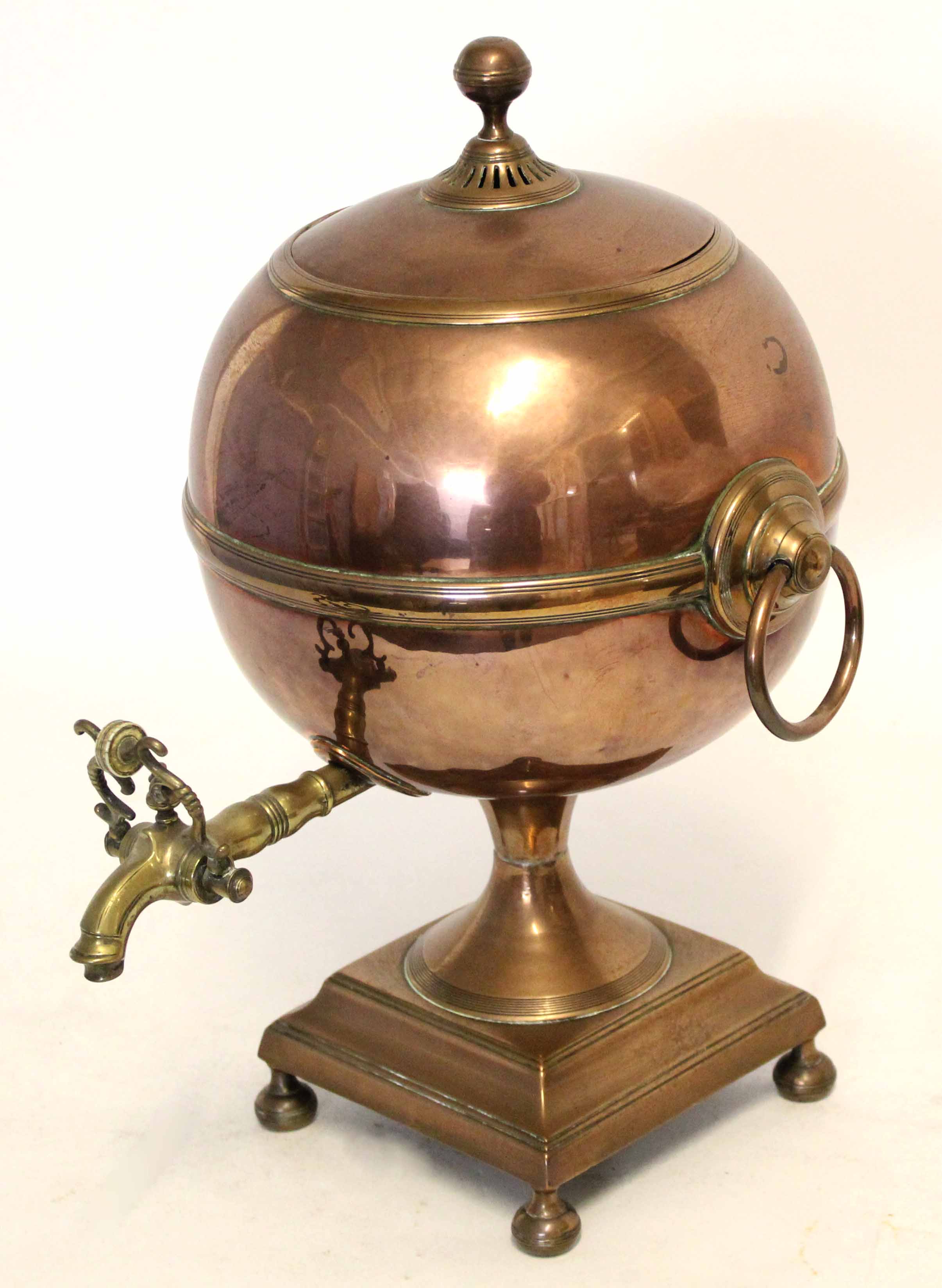 Victorian copper and brass samovar with two ringlet handles either side with finial top with a brass