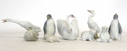 Group of Lladro models including two geese, a swan, some bears and two penguins, (9)
