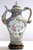 Chinese porcelain kettle or wine jar and cover, decorated in polychrome with two vignettes of