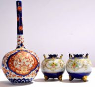 Japanese porcelain bottle vase decorated in Imari style, together with two small Noritake globular