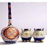 Japanese porcelain bottle vase decorated in Imari style, together with two small Noritake globular