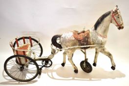 Late 19th or early 20th century tin plate horse and carriage with two fitted pedals to carriage