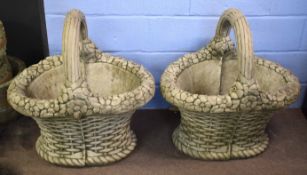 Pair of concrete garden planters formed as baskets with flower encrusted top with lattice work