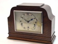 Mid-20th century mahogany cased triple barrel mantel clock, the shaped and arched case with