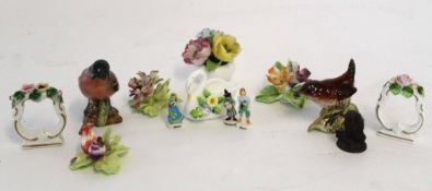 Group of porcelain flowerheads together with a two Beswick models of a chaffinch and a wren, and two