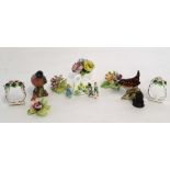 Group of porcelain flowerheads together with a two Beswick models of a chaffinch and a wren, and two