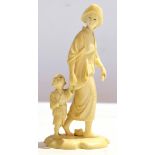 Japanese ivory figure of a lady with a young child by her side, signature to base, 14cm high