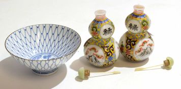 Small Japanese porcelain bowl with a fish in the well, together with two Oriental scent bottles of