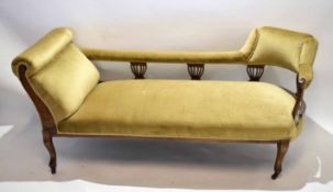 Edwardian walnut framed chaise longue with open back and urn pierced supports with a cream Dralon