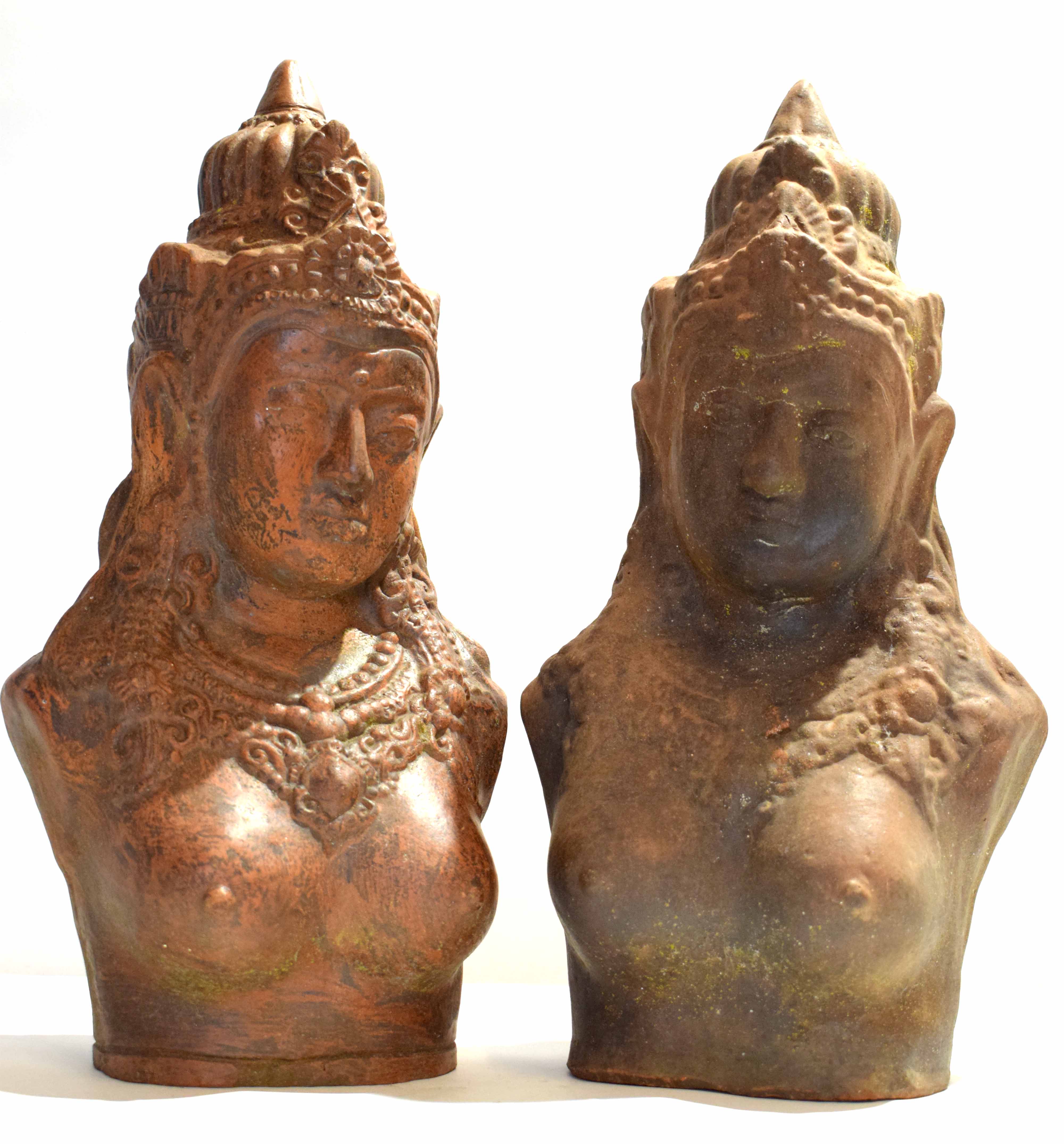 Two Asian pottery busts of women, possibly Hindu deities, 44cm high