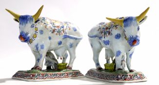 Pair of late 19th century/early 20th century Dutch Deflt milking groups, modelled in typical