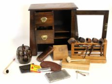 Arts & Crafts style smoker's cabinet with glazed door and two drawers, pipe rack to either side