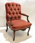 Louise XV type walnut carved armchair with red Dralon upholstery with button back and heavily carved