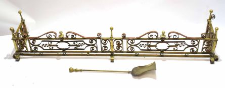 19th century brass and copper large proportion fender with scrolling detail and brass caps, 58cm