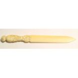 Bone letter opener with carved handle, 29cm long