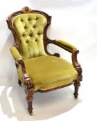 19th century walnut framed armchair with carved top and shaped arms with green Dralon upholstery and