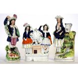 Group of three Staffordshire flat back figures, all decorated in typical fashion, largest 23cm high