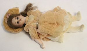 Small early 20th century porcelain headed doll by Armand Marseille with old, possibly original,