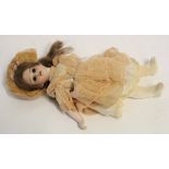 Small early 20th century porcelain headed doll by Armand Marseille with old, possibly original,