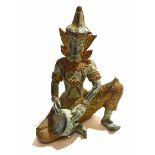 Oriental figure of a Hindu deity playing a tambourine with gilt highlights, 15cm high