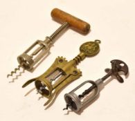 Packet: containing three steel/brass mechanical corkscrews, the brass example with crest to