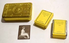 WWI Queen Mary Christmas tin of typical lacquered brass form and containing an opened full packet of