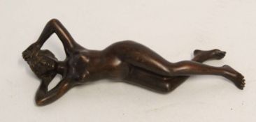 Antique bronze of a reclining nude stamped "Geschutzt", 18cm wide