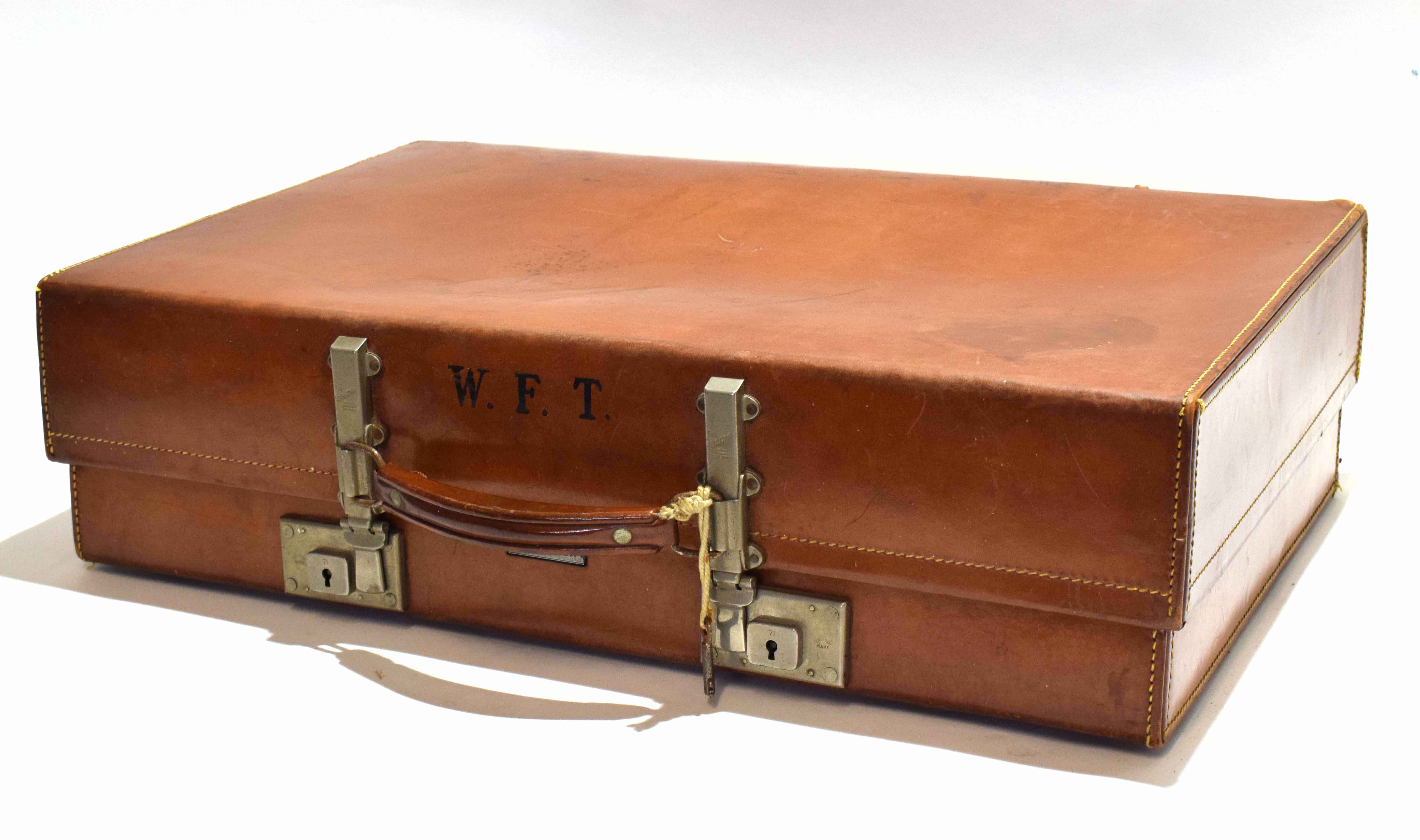 Vintage Revelation leather suitcase with nickel finished fitting, initial to front W F T