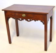 19th century mahogany side table of rectangular form with a central frieze drawer above scrolled