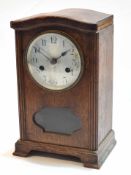 Mid-20th century oak cased mantel clock, the arched hood (detached) with canted and reeded corners