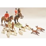 Group of Beswick hunting items including a huntsman in typical attire with a further huntsman on a