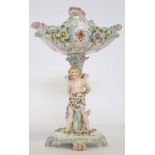 Continental porcelain centrepiece modelled with a cherub supporting the main stand, the bowl with