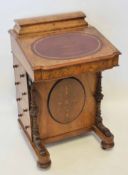 Victorian walnut Davenport, the back with stationery compartment with a lifting lid over a sloping