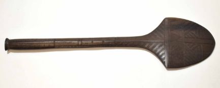 20th century South Pacific hardwood club of bladed form with incised decoration, length 60cm