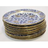 Group of twelve early 19th century Spode side plates with a blue and white design highlighted with