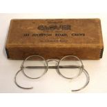 Pair of vintage chromed metal spectacles together with original metal mounted supply box