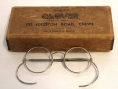 Pair of vintage chromed metal spectacles together with original metal mounted supply box