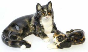 Pair of Winstanley cats decorated in typical fashion with glass eyes, signed to the base