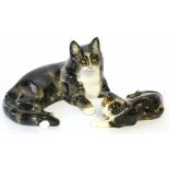 Pair of Winstanley cats decorated in typical fashion with glass eyes, signed to the base
