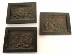Group of three antique pressed metal plaques depicting cherubs and putti, each image 11 x 15cm (3)